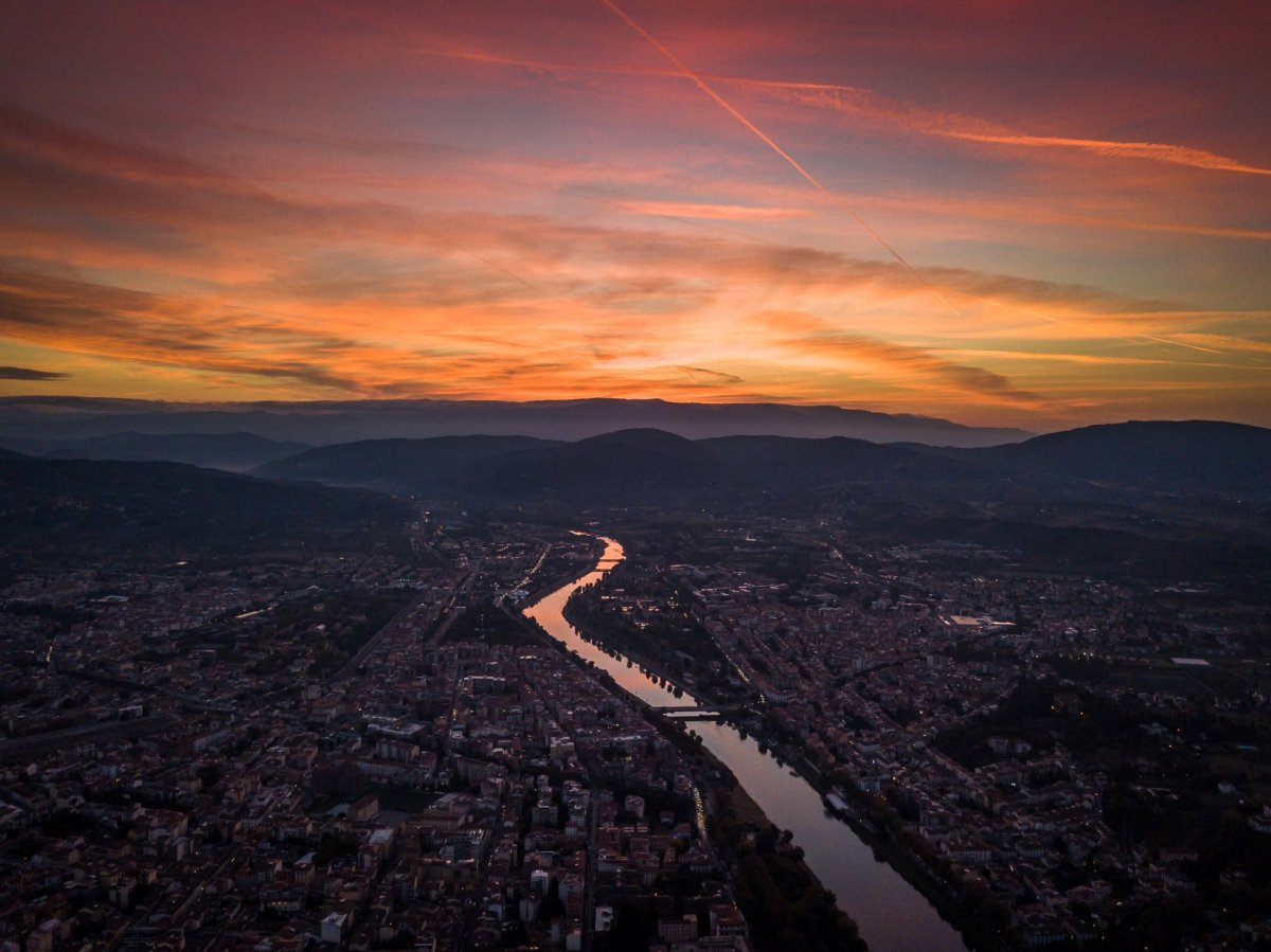 Sunrise and river Arno from drone