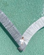 Girl and sea from above drone photography