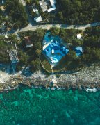 House and clear sea drone photography